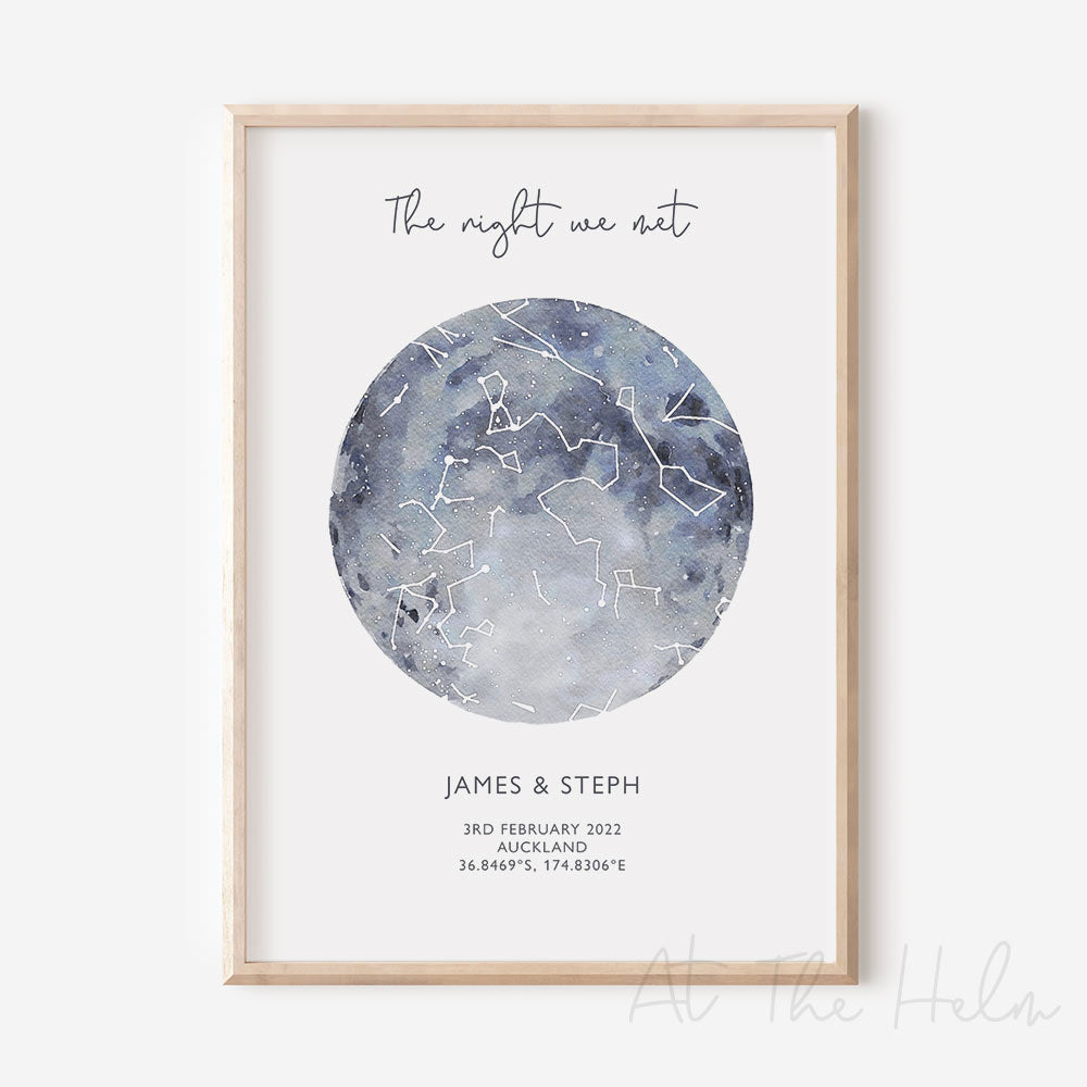Framed custom blue watercolour star map print with text personalization.
Headline text reads " The Night We Met". Secondary text at the bottom reads " James & Steph" and then a personalised special date, location and map coordinates.