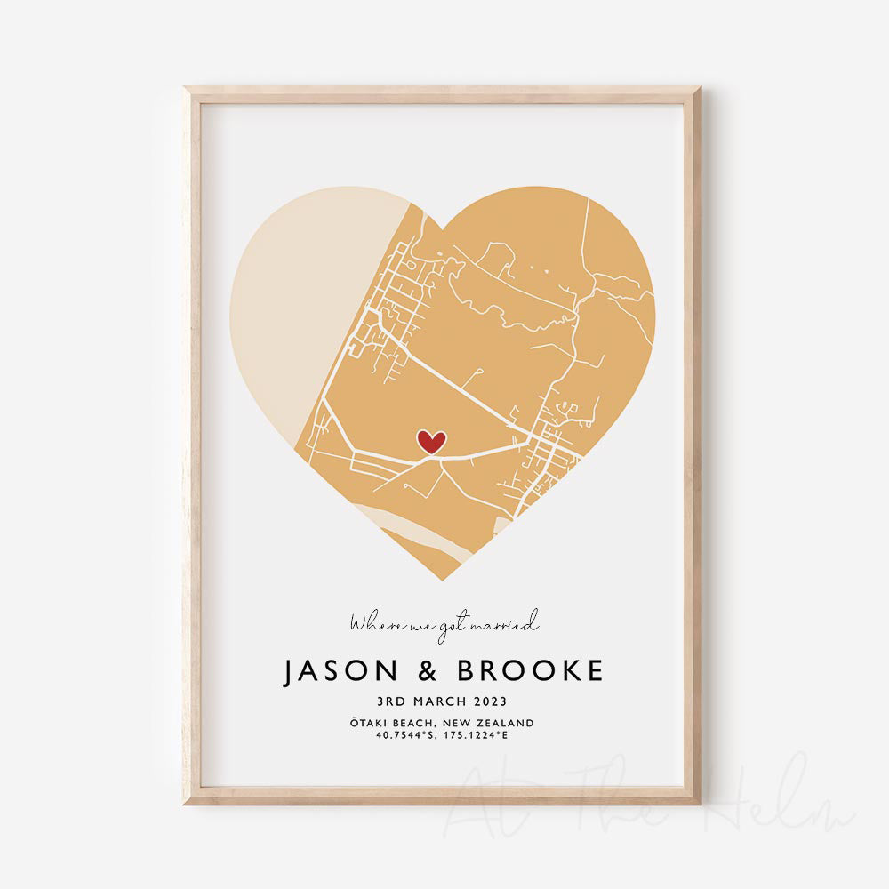 Framed yellow and white heart-shaped map print with text personalization.
A red heart marks a specific location.
Small cursive headline text reads " Where we got married"". Secondary capitalized text (slightly larger) below that reads "JASON & BROOKE" and then a personalised special date, location and map coordinates.