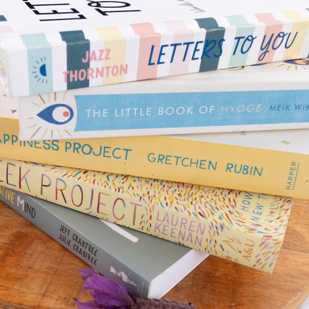 image shows a stack of second-hand pre-loved non-fiction books sold on At The Helm NZ