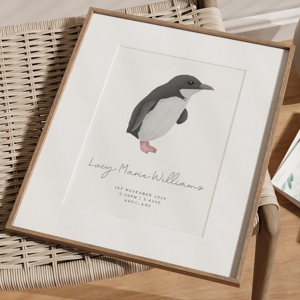 Framed print with a penguin illustration and text on a woven surface